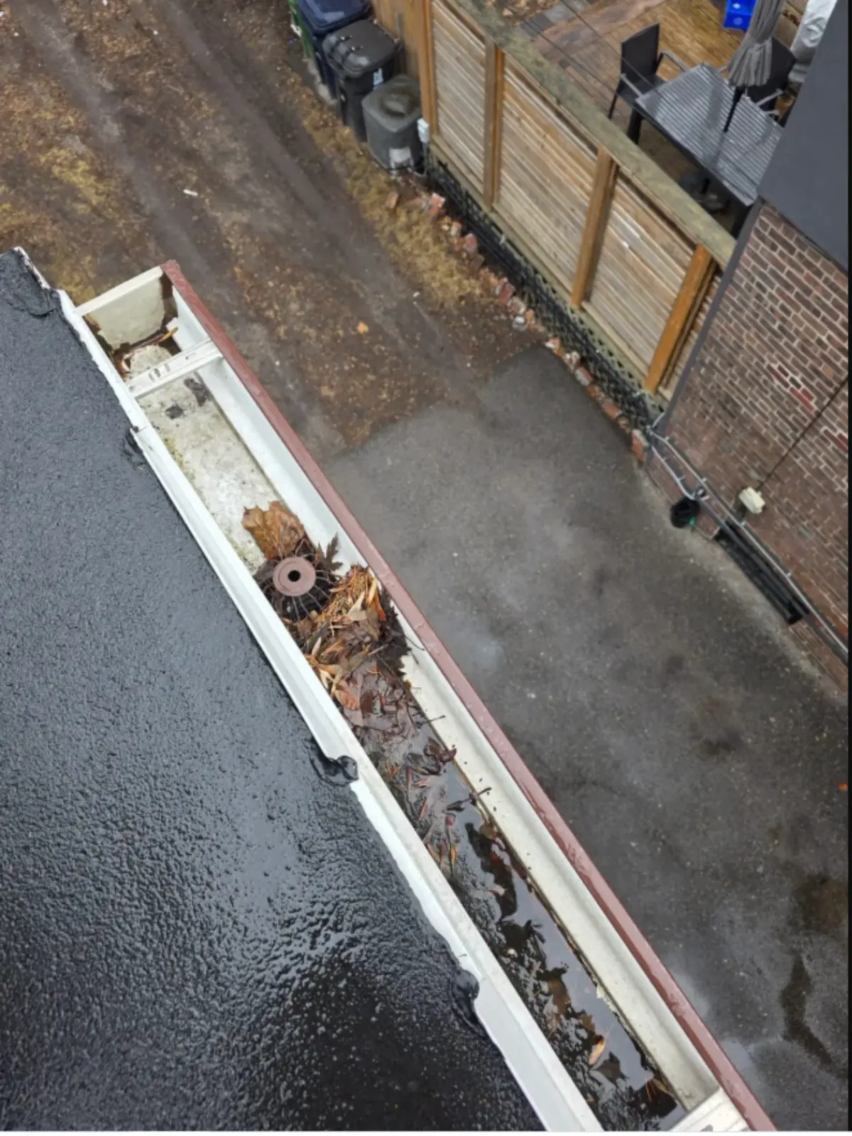 Blocked eavestrough with leaves and debris cleared by SUDS in East York