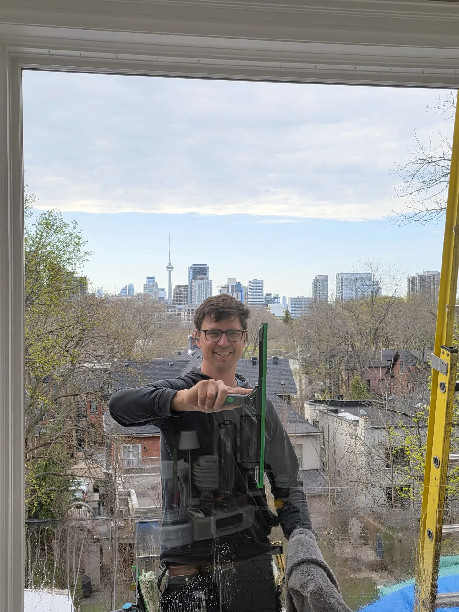 Window cleaner with Toronto skyline