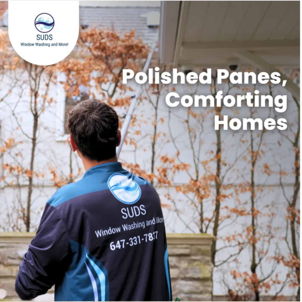 A professional technician from SUDS Window and Eaves Cleaning using an extension pole to clear debris and maintain a residential home's exterior in Toronto.