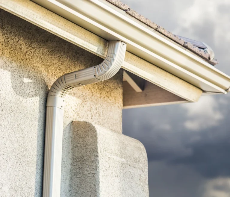 Seamless eavestrough Toronto system with downspout installed on a residential property.